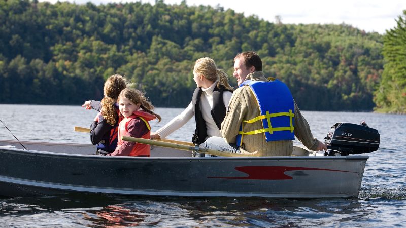 What should you do first when a passenger on your boat falls overboard?